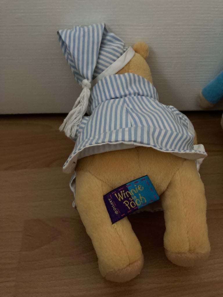 Selection of soft toys inc Peter rabbit bunny, giraffe, Winnie the Pooh and animal stacking ring