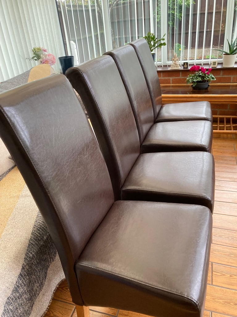 image for 4 Brown faux chairs 