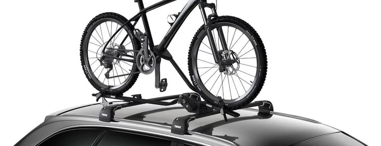 Two Thule roof racks and two roof bars 