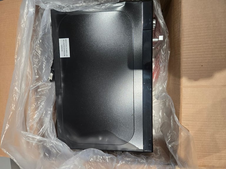 Brand new russell hobbs (rhm2060b) microwave with a small dent on the side (working perfectly)