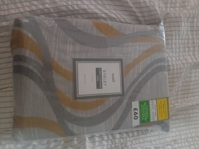 Brand new never used dunelm curtains.. grey amd ochre. 