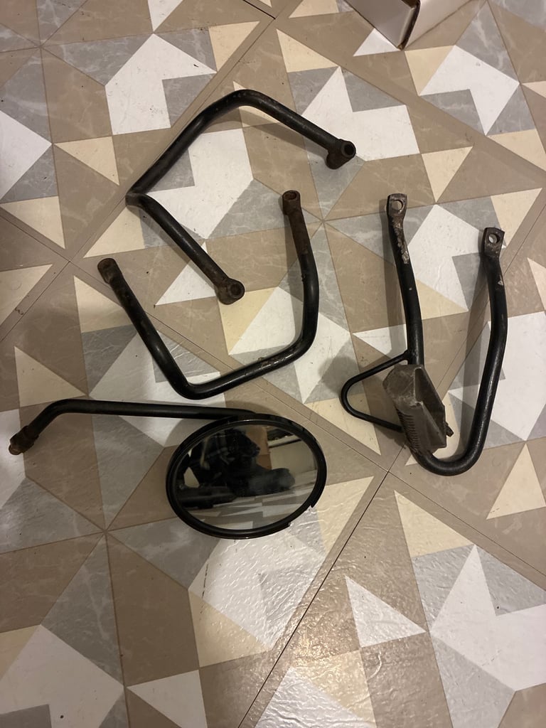 Few bullit hero parts rear hand grabs left rear foot rest and right side mirror