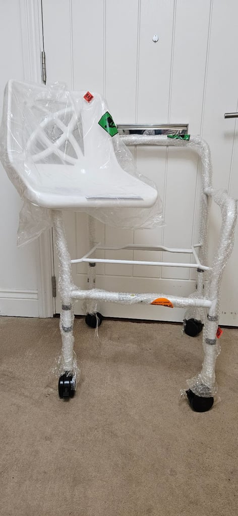image for NEW - Wheeled, height adjustable shower chair