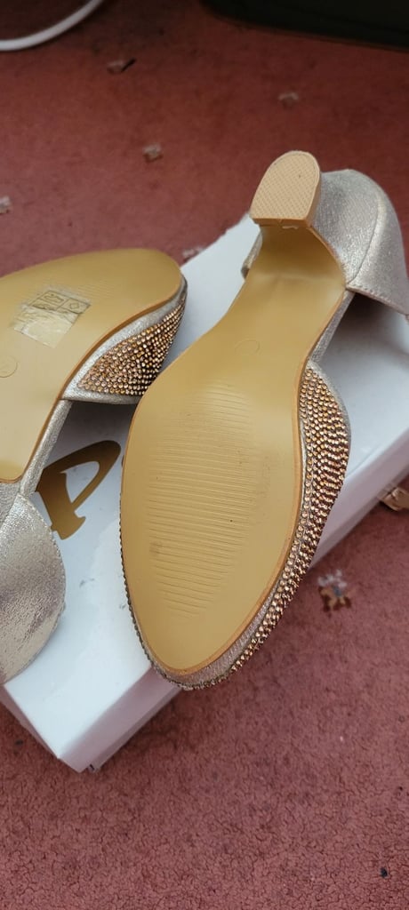 Girls gold heel sandals.