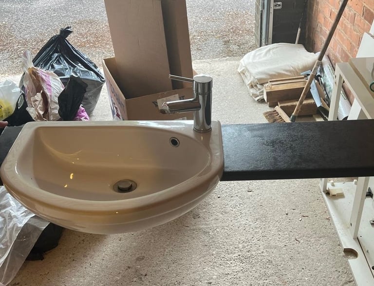 WC, wash hand basin with tap, and unit