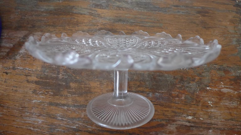 VINTAGE ANTIQUE GLASS CAKE STAND ON GLASS PEDESTAL.TASSA. SCALLOPED EDGE.