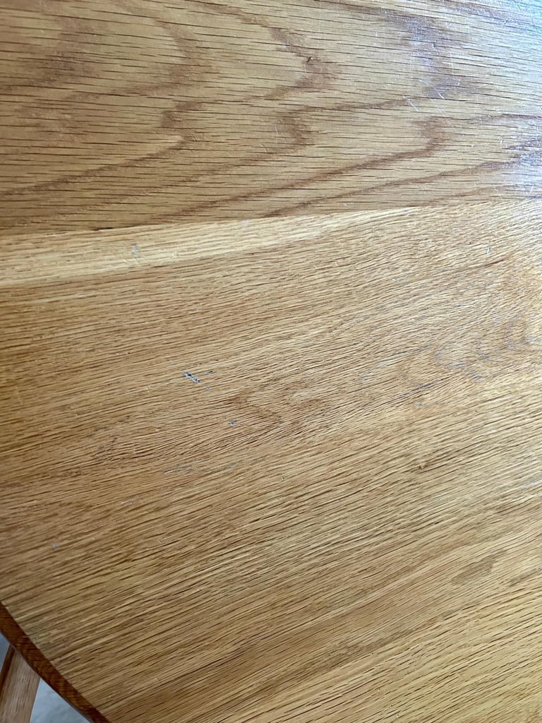 Solid oak dining table and four chairs