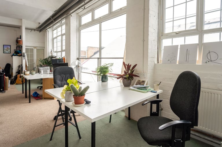 Deskspace in shared artist co-working space