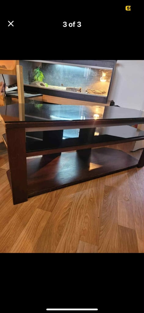 image for Wooden TV stand with two glass shelves. 