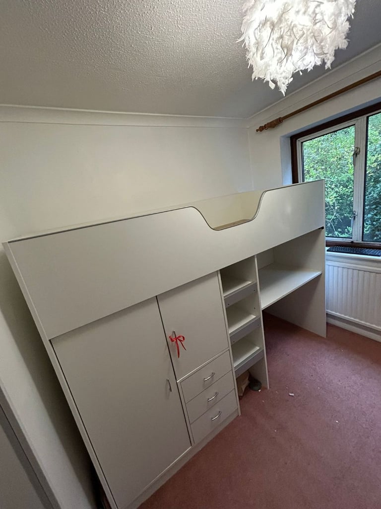 Cabin bed with built-in wardrobe and workstation. 