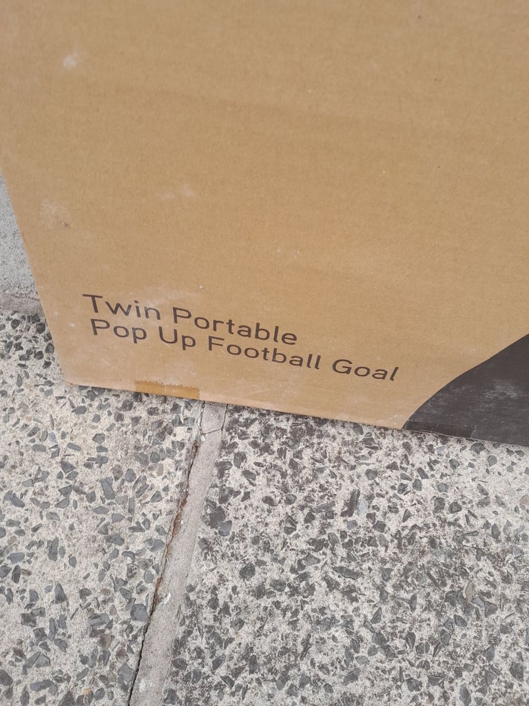 Twin portable pop up football by opti at Argos.  Plus storage bag and box