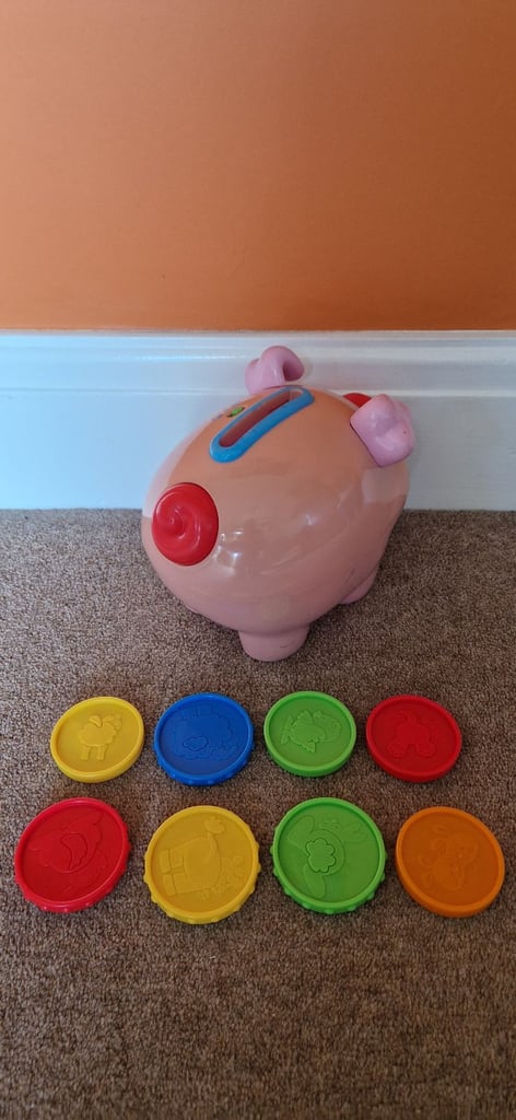 FISHER PRICE LAUGH AND LEARN COUNTING PIG. INCLUDES BATTERIES.