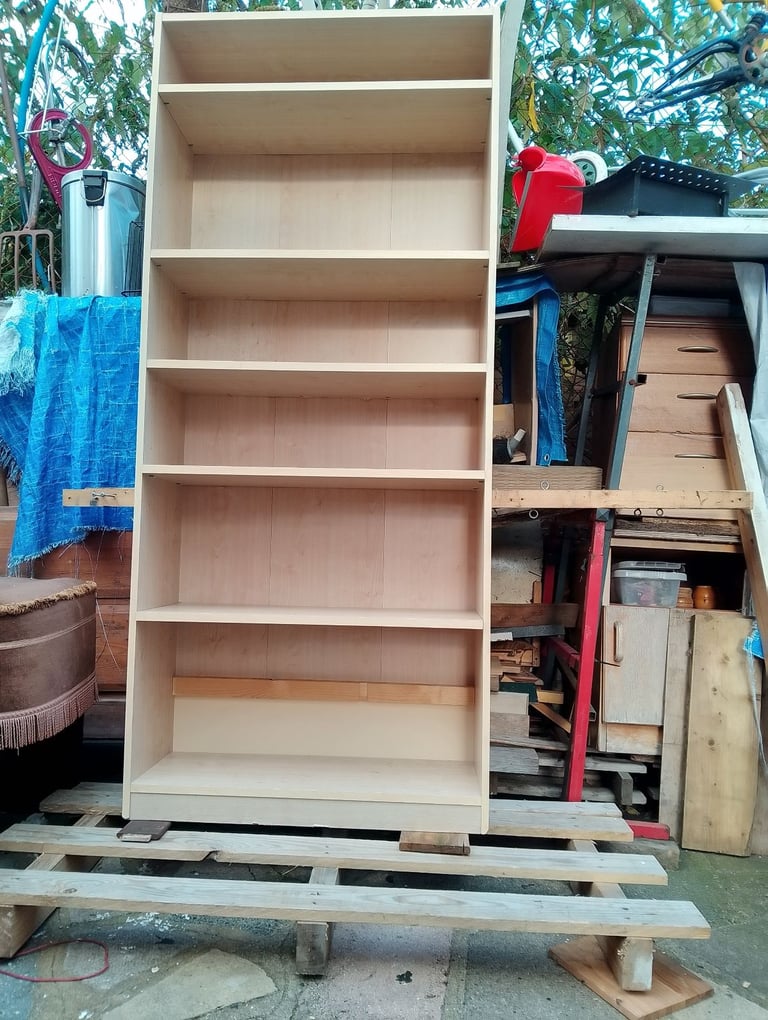 Very tall shelving unit in new condition spotlessly clean inside and out 