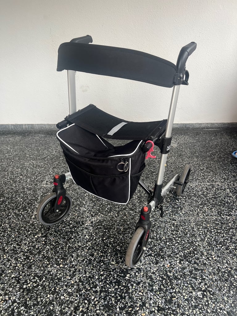 Compact walker aid with seat, bag and height adjustable 