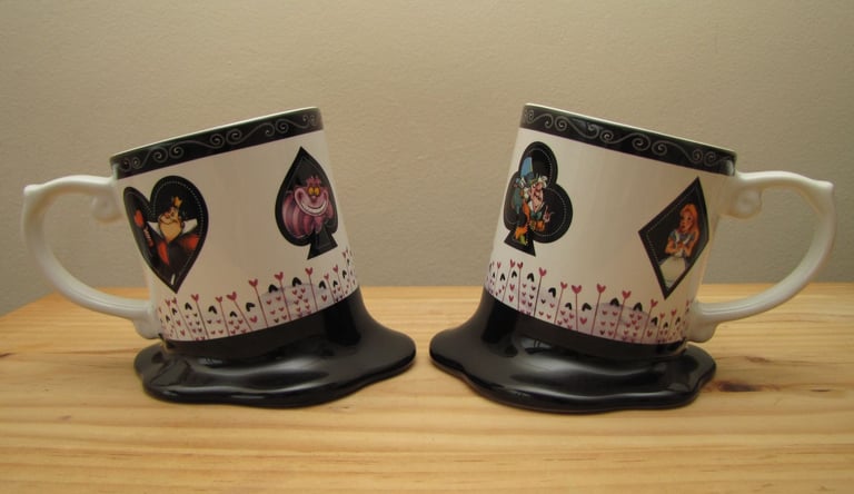 image for Alice In Wonderland 2 melting mugs from Disneyland Paris - displayed only, unused