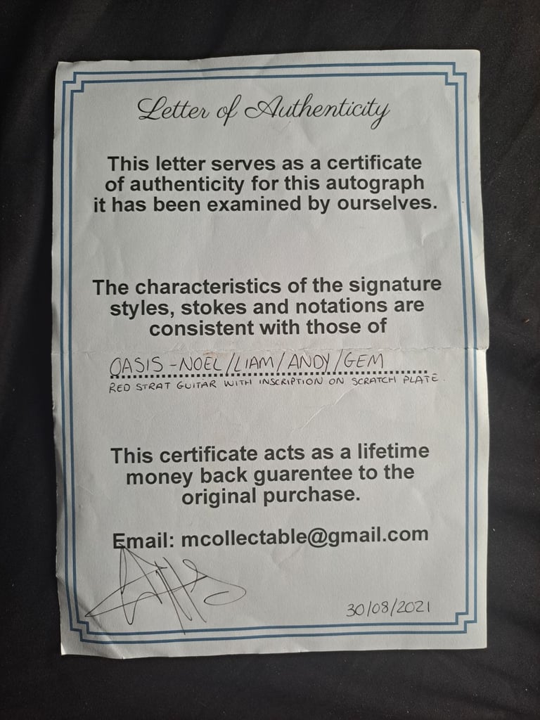Oasis signed guitar . Genuine!