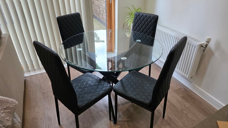 image for Modern Novara Round Glass Dining Table & 4 Black Quilted Chairs – £150