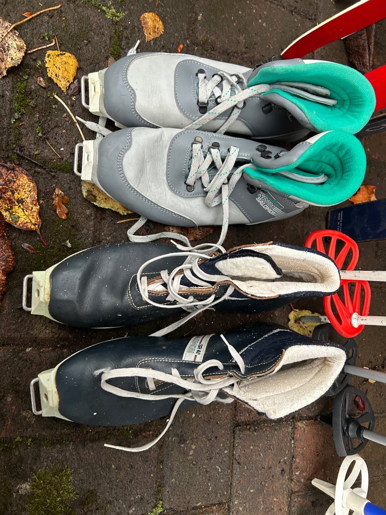 Various cross country skis, poles and boots