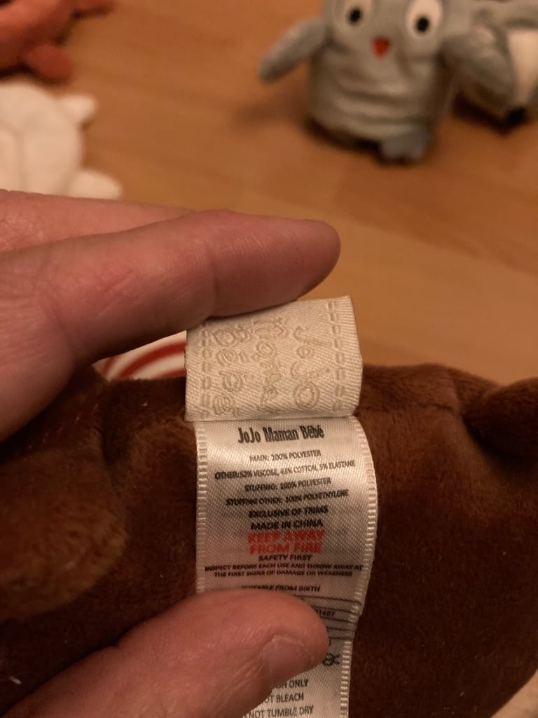 Selection of soft toys inc Peter rabbit bunny, giraffe, Winnie the Pooh and animal stacking ring