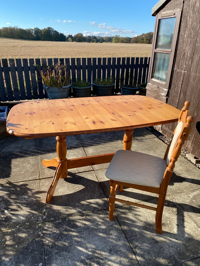image for Extending wooden dining table.