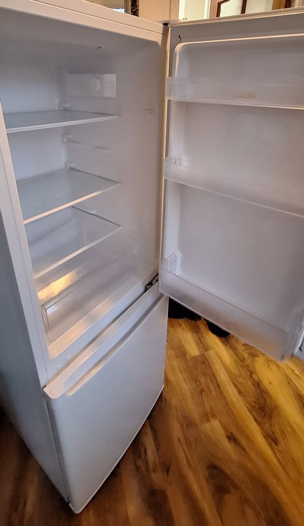 LOGIK fridge freezer size  H 142cm like new one year old 