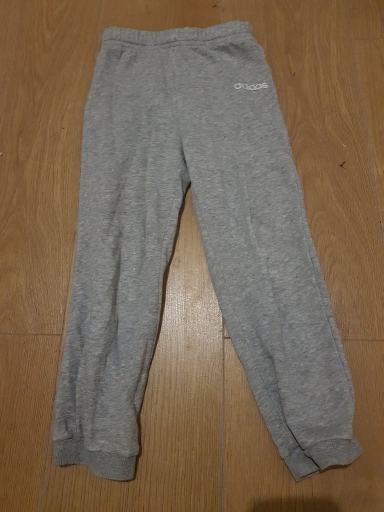 Childrens unisex Adidas grey jogging bottoms.