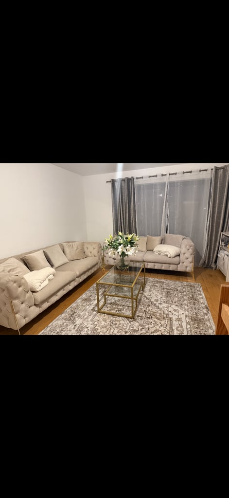 Cream/beige sofa with gold detailing 