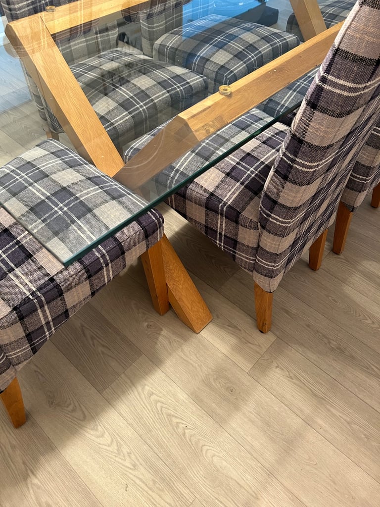 Very good condition, large glass dining table and six chairs for sale