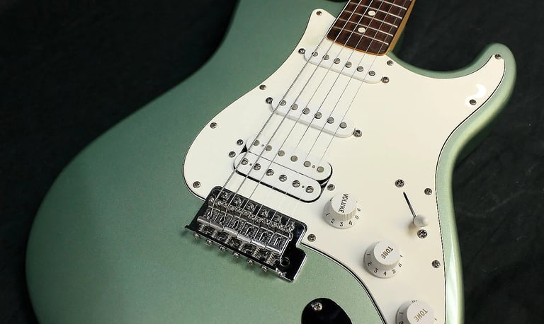 Mexican Fat Strat, Guitar bag, Guitar strap, Guitar stand, Guitar Tuner. 