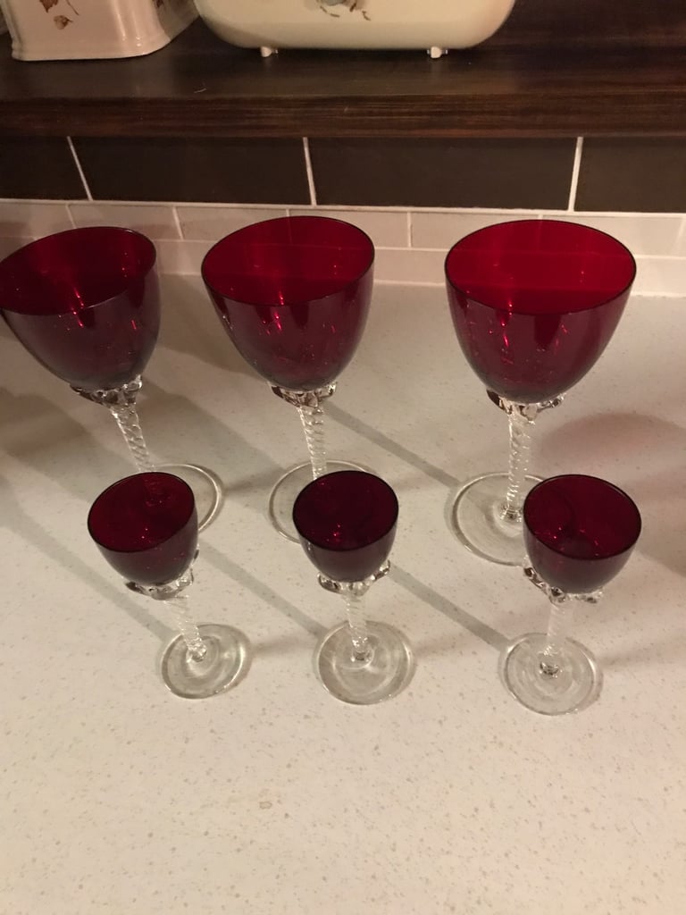 So red glasses with swished stems