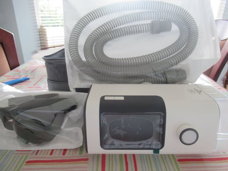 CPAP machine with humidifier, Brand New, with hose holder