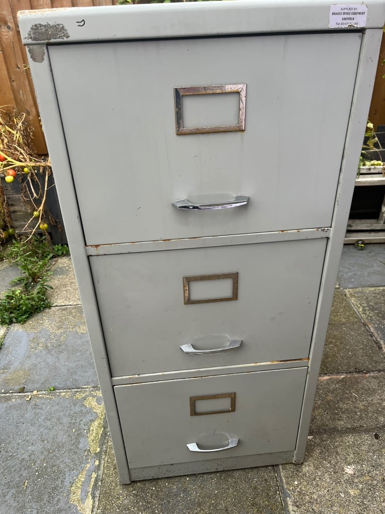 image for METAL 3 DOOR FILING CABINET WITH SOME FILES