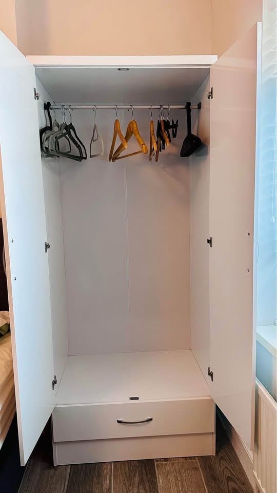 image for White wardrobe with large draw at the bottom.