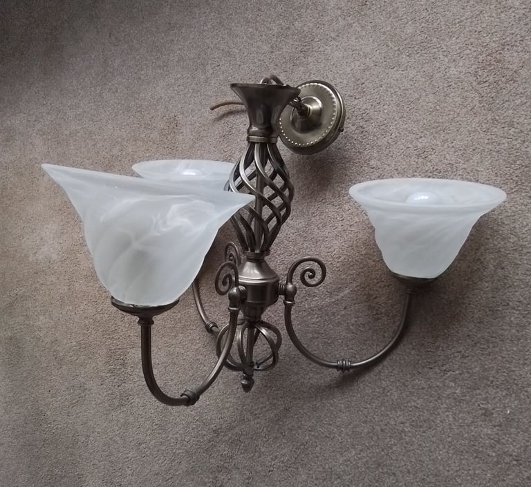 3 light, antique brass effect chandelier. 