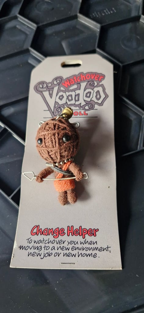 Collectible voodoo doll change helper