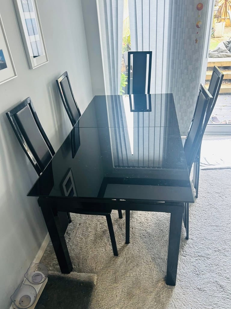 Harveys glass table and 6 chairs 