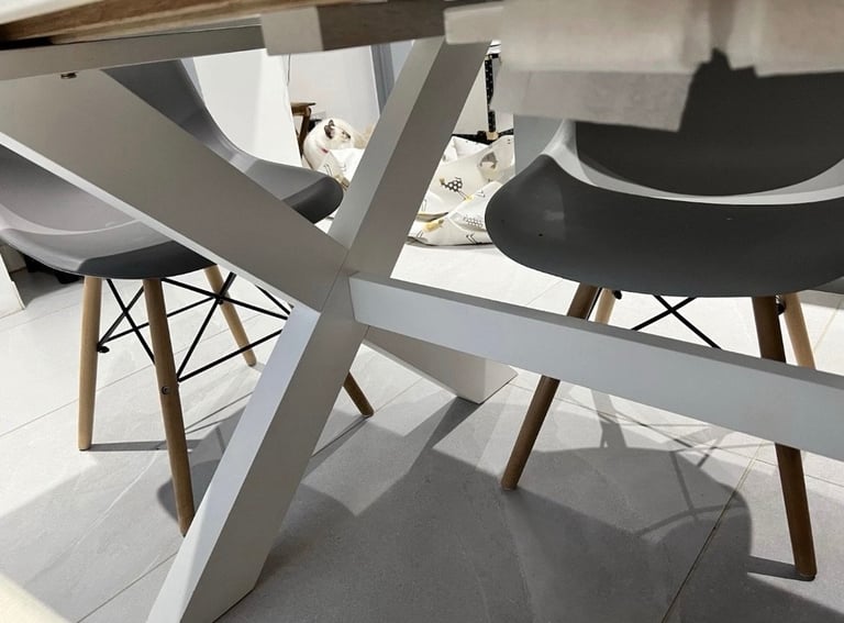 White extendable dining table. Seats up to 10-12