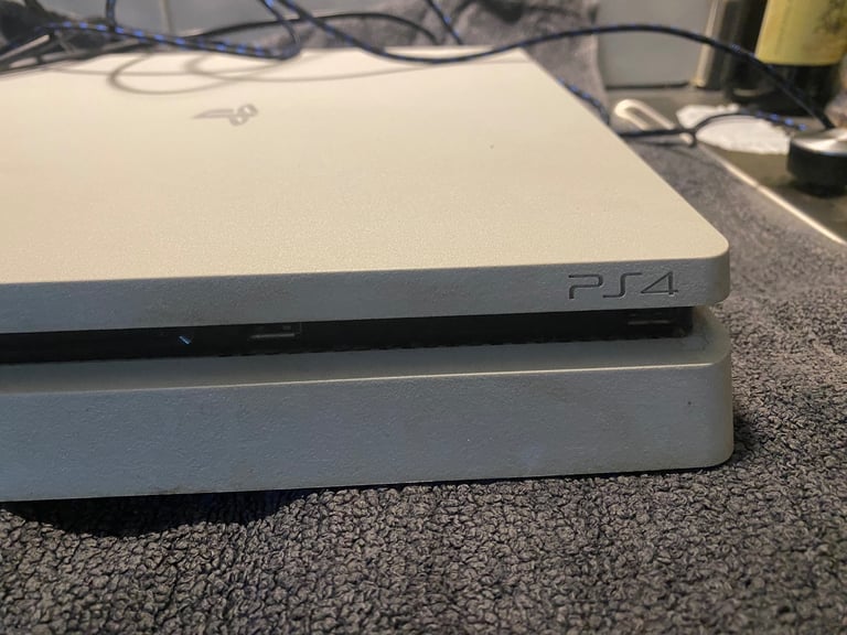 PS4 with 3 games, 1 wireless controller and docking station/charger for controller