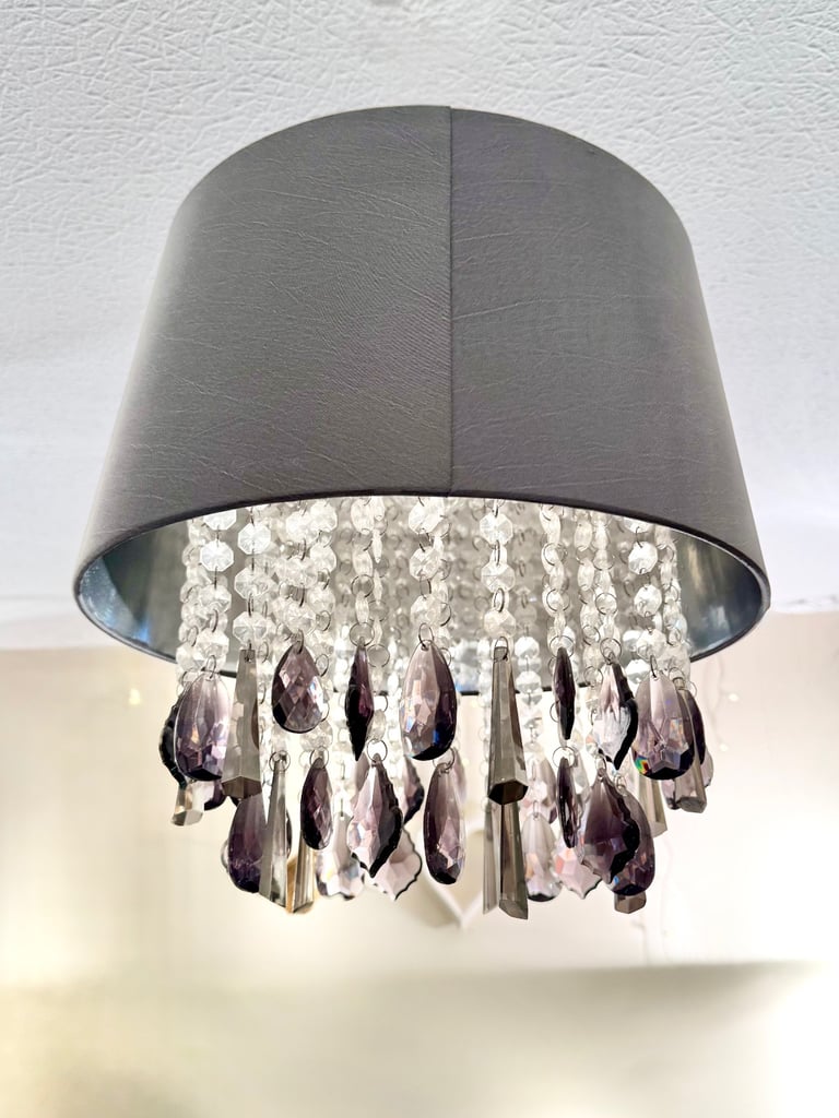 Grey pleated satin shade with drop cristals Measuring 35x 35 cm. Drop crystal plastic 
