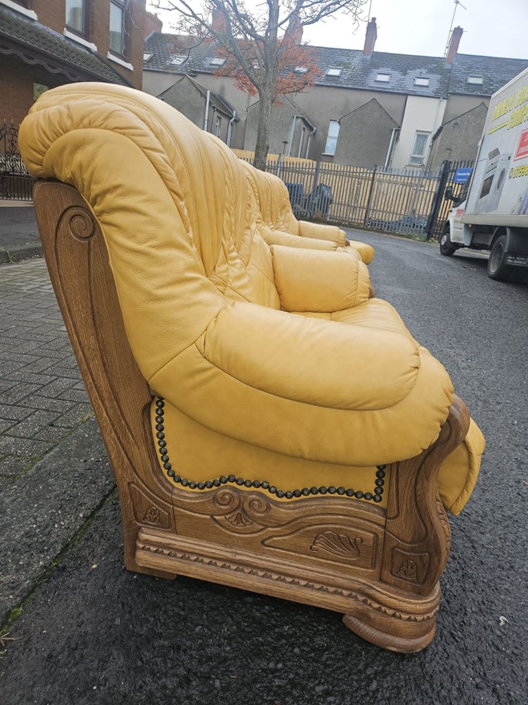 Leather sofa in soild oak inset with matching footstool 