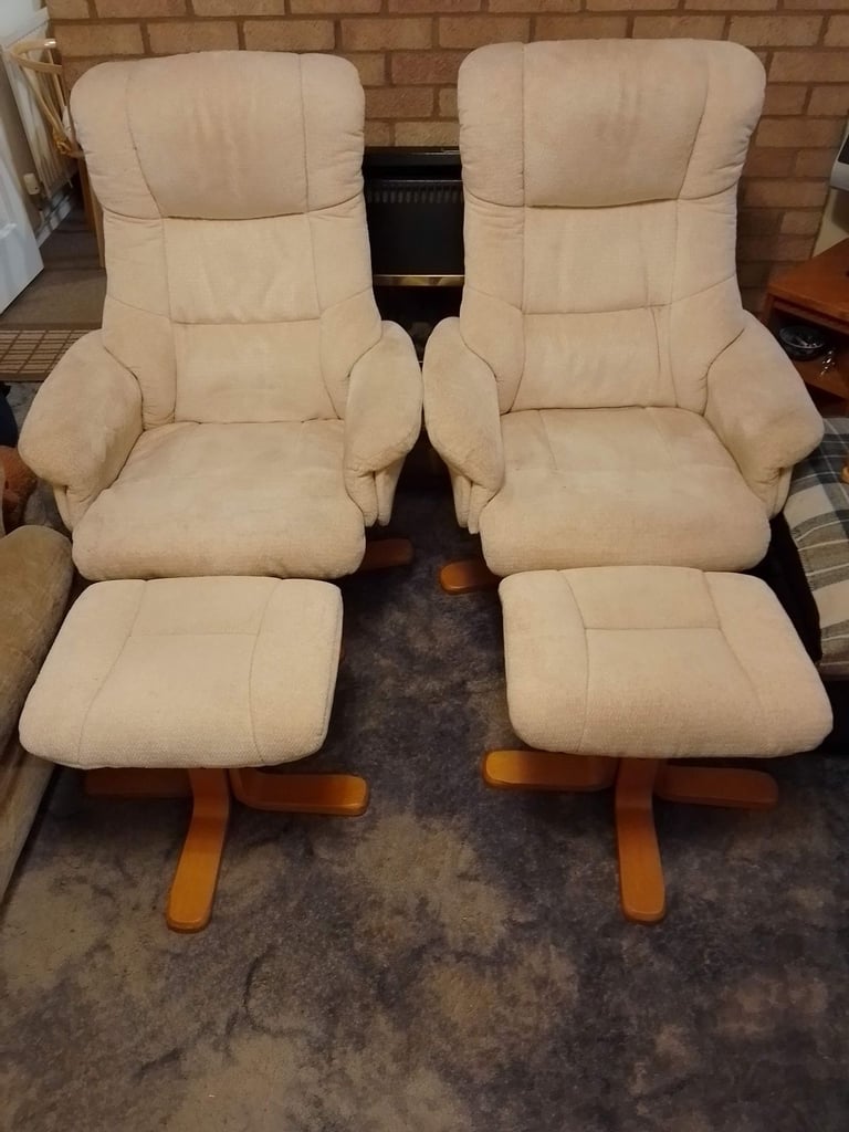 A pair of Light cream colour material Armchairs with Footstools - Has Fire Labels on each Item.