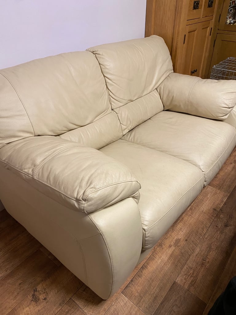 Two seater leather cream sofa very good condition. 