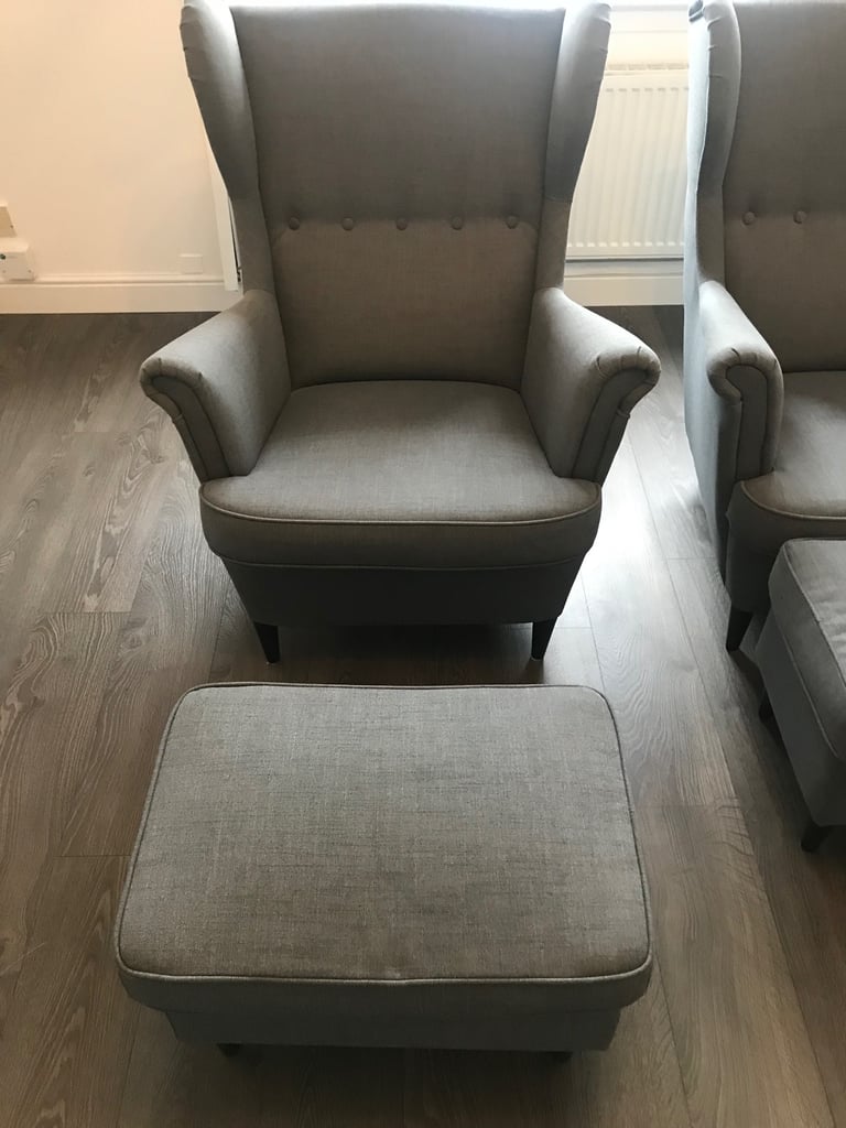 2 grey fabric high backed wing tipped chair with matching 2 grey fabric footstools, £140 for all 