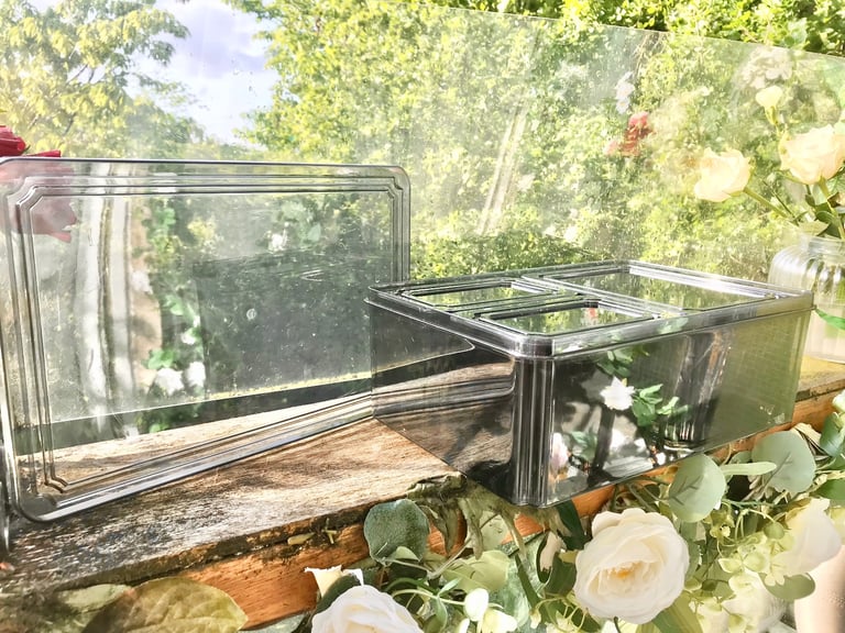 Good quality. Set of 4 Black tint plastic storage boxes Only used a few times