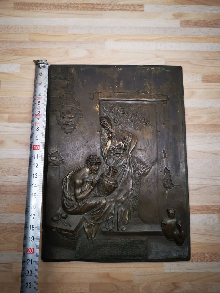 Two mounted bronze 19th Century musician ornaments with a metal plaque