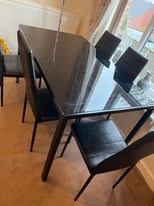 Black glass table and 5 chairs 