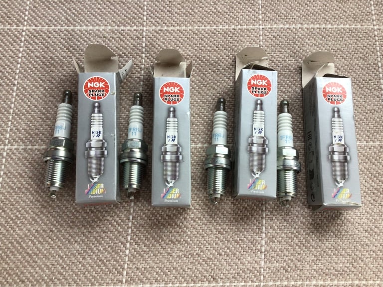 image for X 4 brand new NGK spark plugs IFR6J11. 