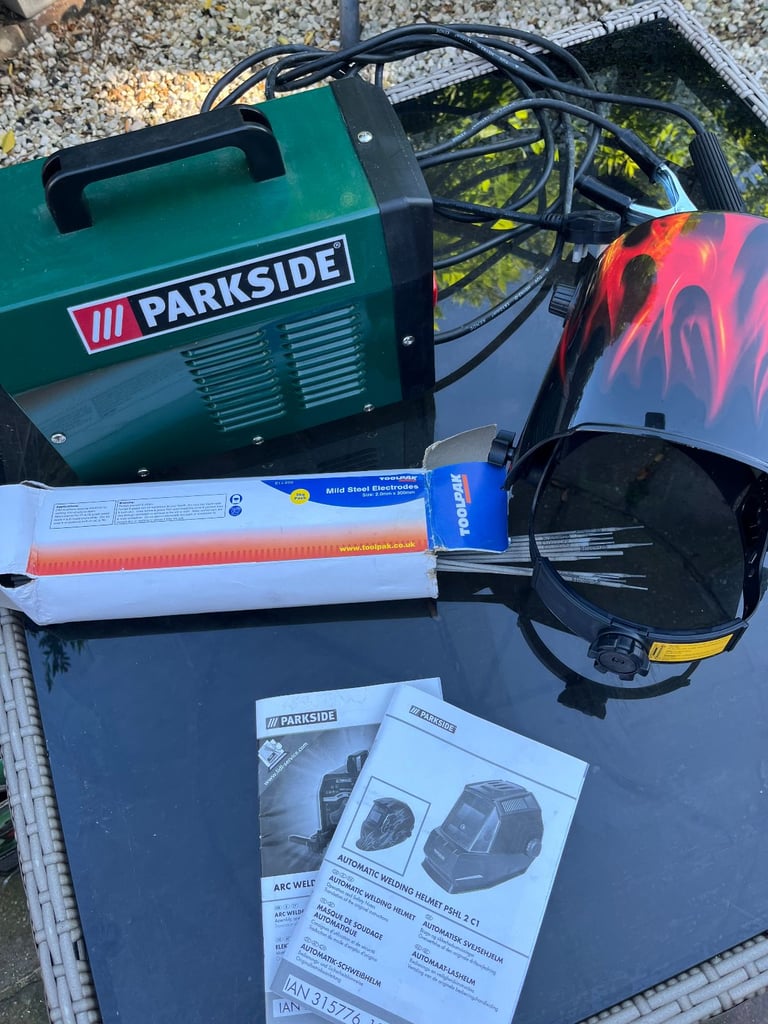 ARC WELDER + AUTO WELDING HELMET + BOX OF RODS