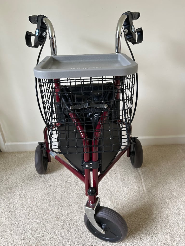 Three wheeled rollator/walker with basket and tray and bag