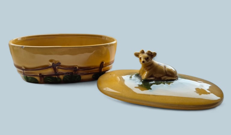 Collector's Guernsey cow butter dish, has 2 small chip round rim not visible when lid is on. 